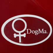 DogMa Weatherproof Sticker on Red Car